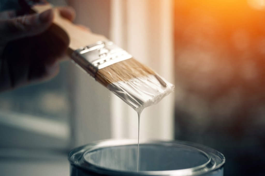 A person holding paint brush