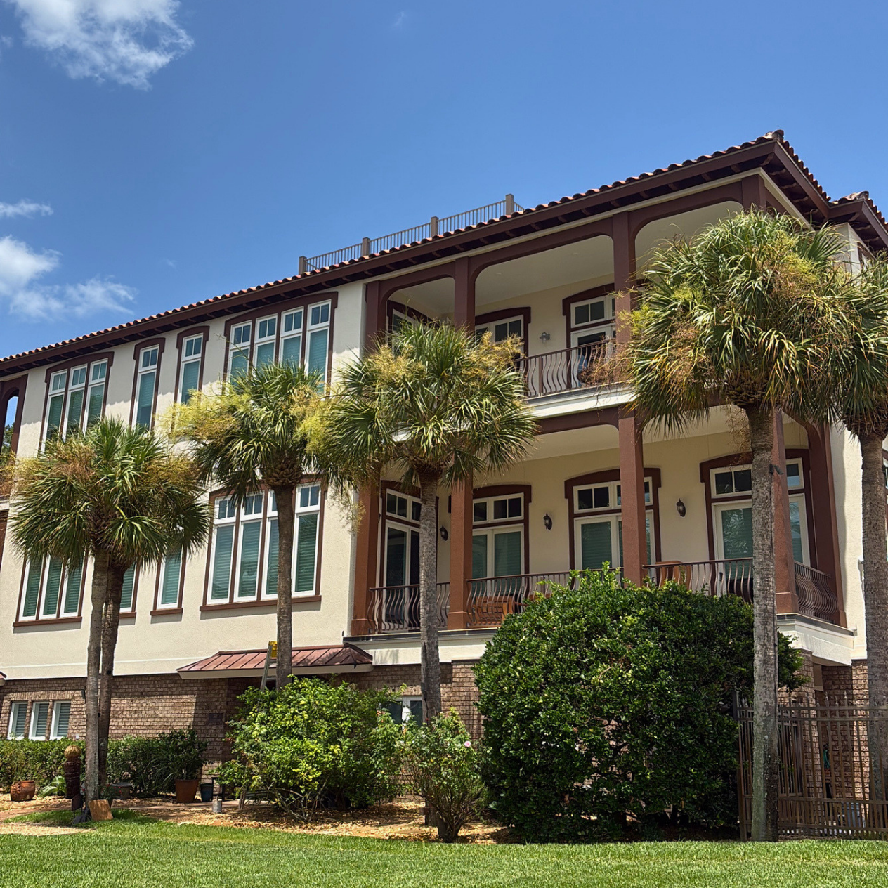 Two-story home exterior repaint with white trim detail