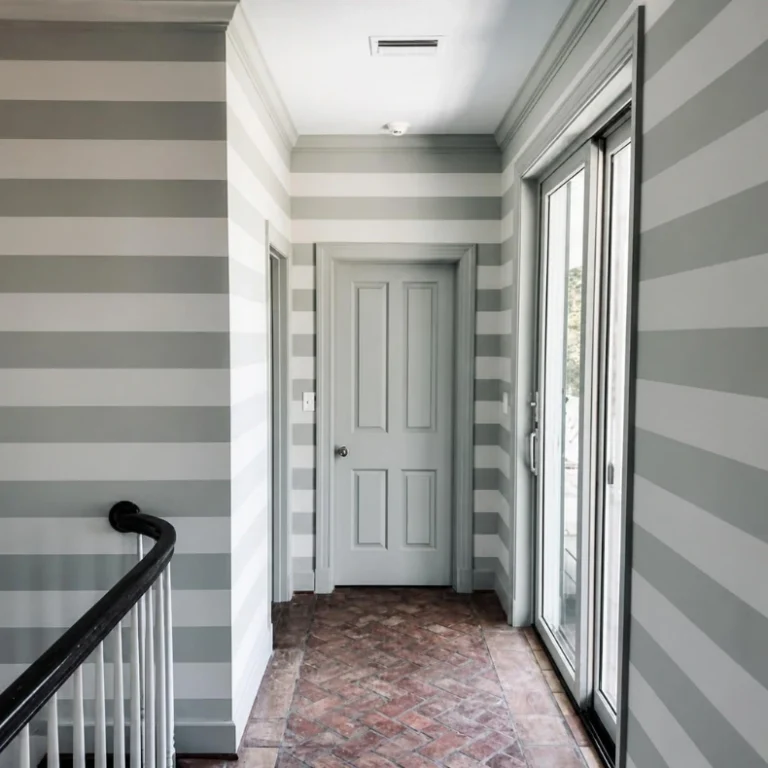 Gray and white striped wall finish in a hallway