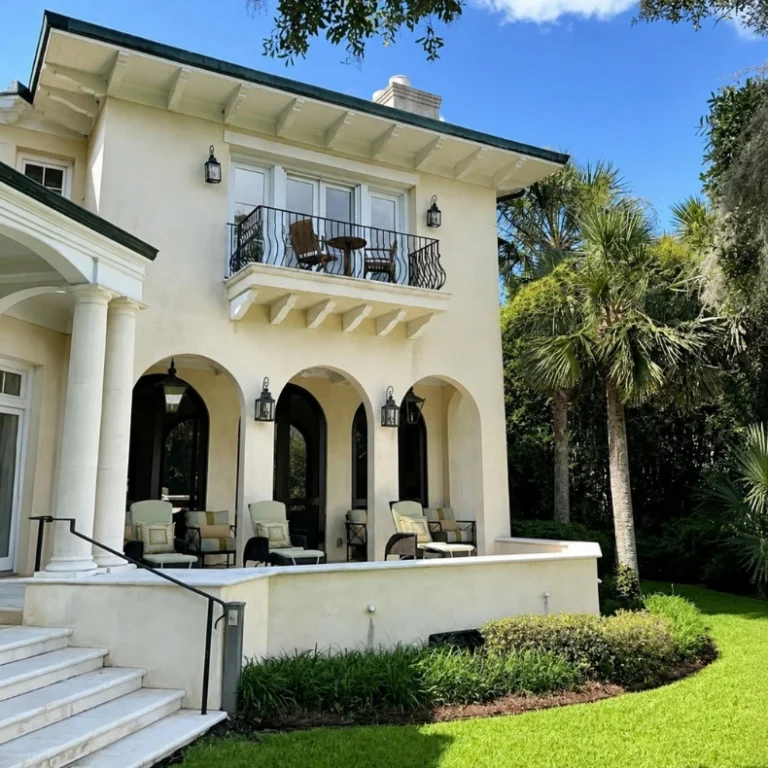 Two-story stucco home after exterior painting