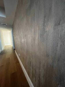 Gray Venetian plaster walls with layered movement and a smooth polished appearance.